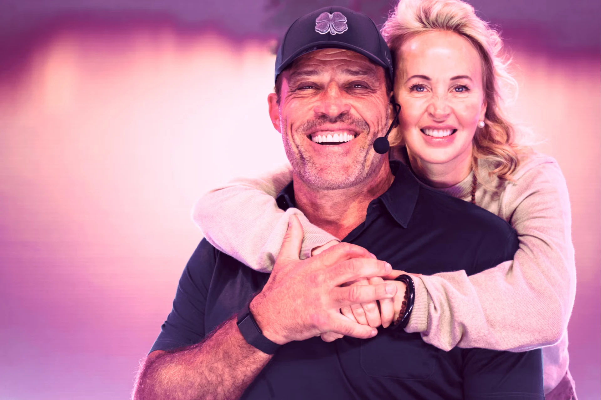Tony and Sage Robbins embracing and smiling together